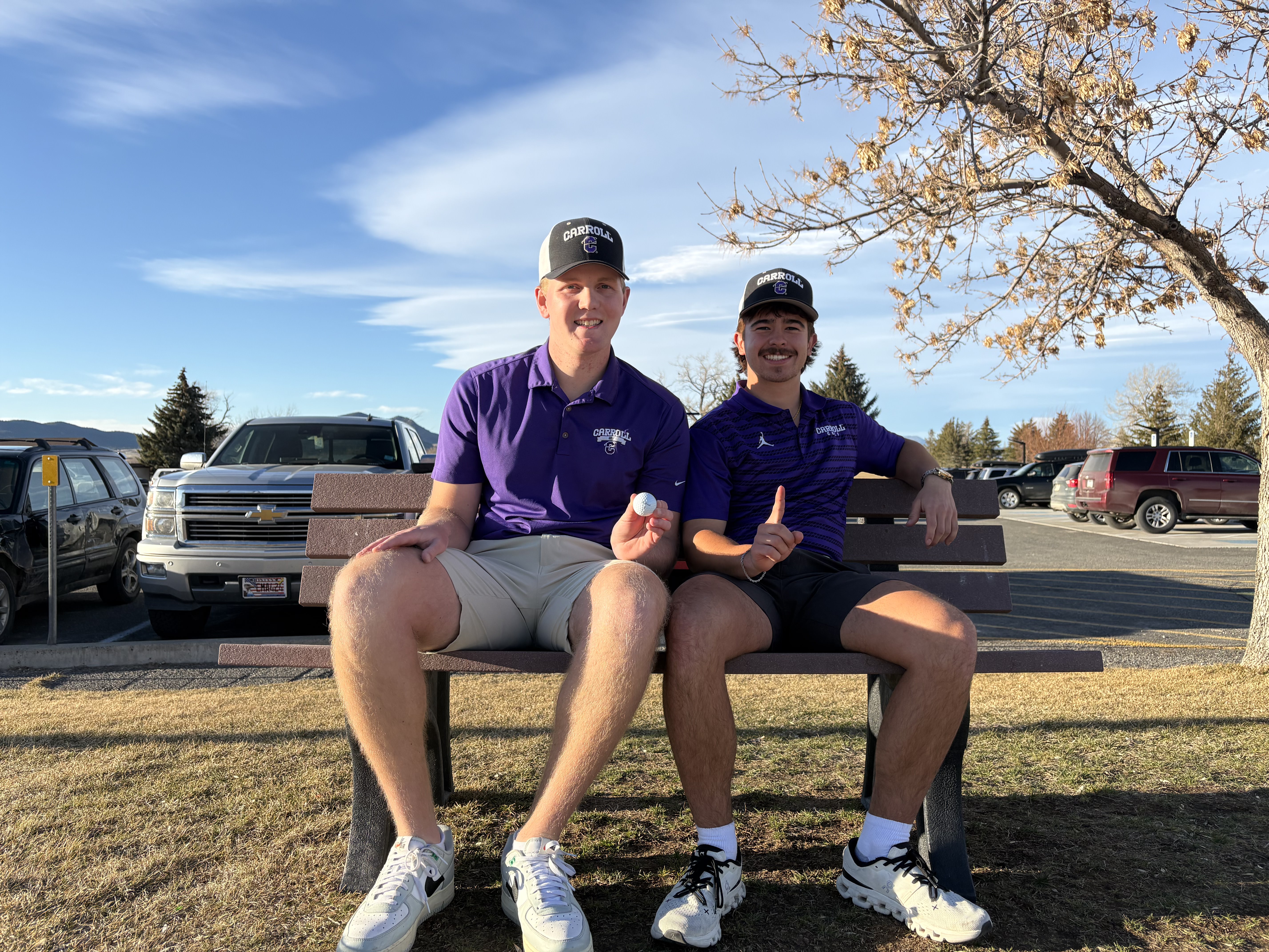 Carroll men's golfers Taylor "TJ" Fierling (left) and Hudson Reinke (right) sit side-by-side at Bill Roberts Golf Course.