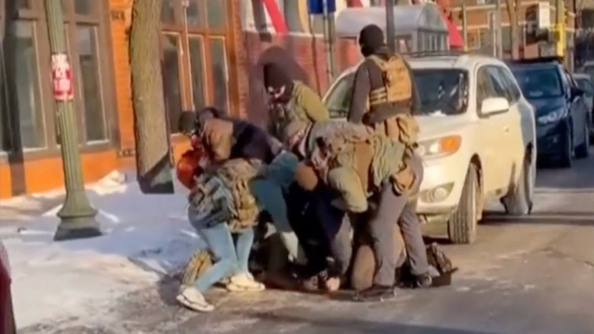 This still from video captured by a bystander shows the moments before a federal immigration agent fatally shot Alex Pretti.