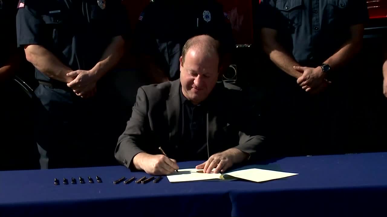gov. jared polis paid admin leave volunteer firefighters.jpg