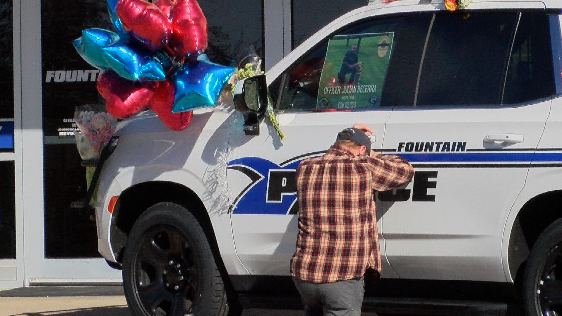 A man mourns the loss of Officer Julian Becerra