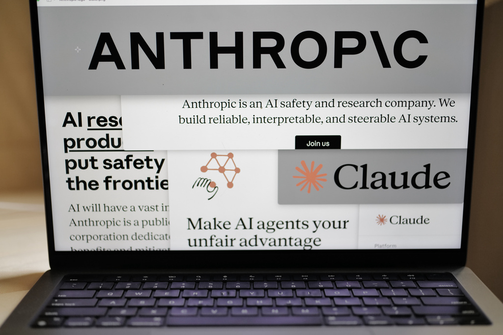 FILE - Pages from the Anthropic website and the company's logos are displayed on a computer screen.