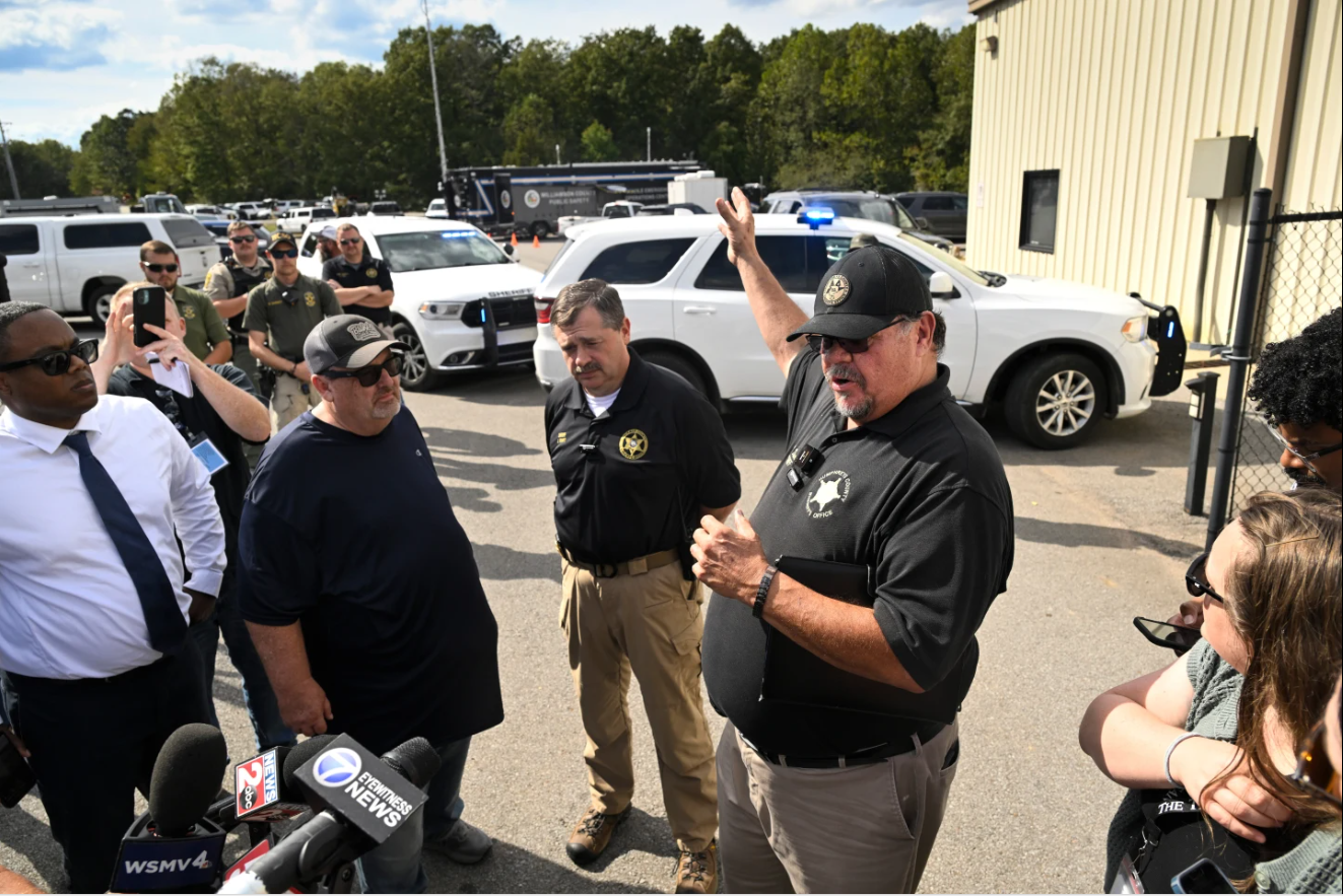 Humphreys County Sheriff Chris Davis, right, stands next to Hickman County Sheriff J. Craft as they address the press during a news conference at Accurate Energetic Systems, an explosives plant, after a blast resulted in multiple fatalities and others missing Friday, Oct. 10, 2025, in Bucksnort, Tenn.