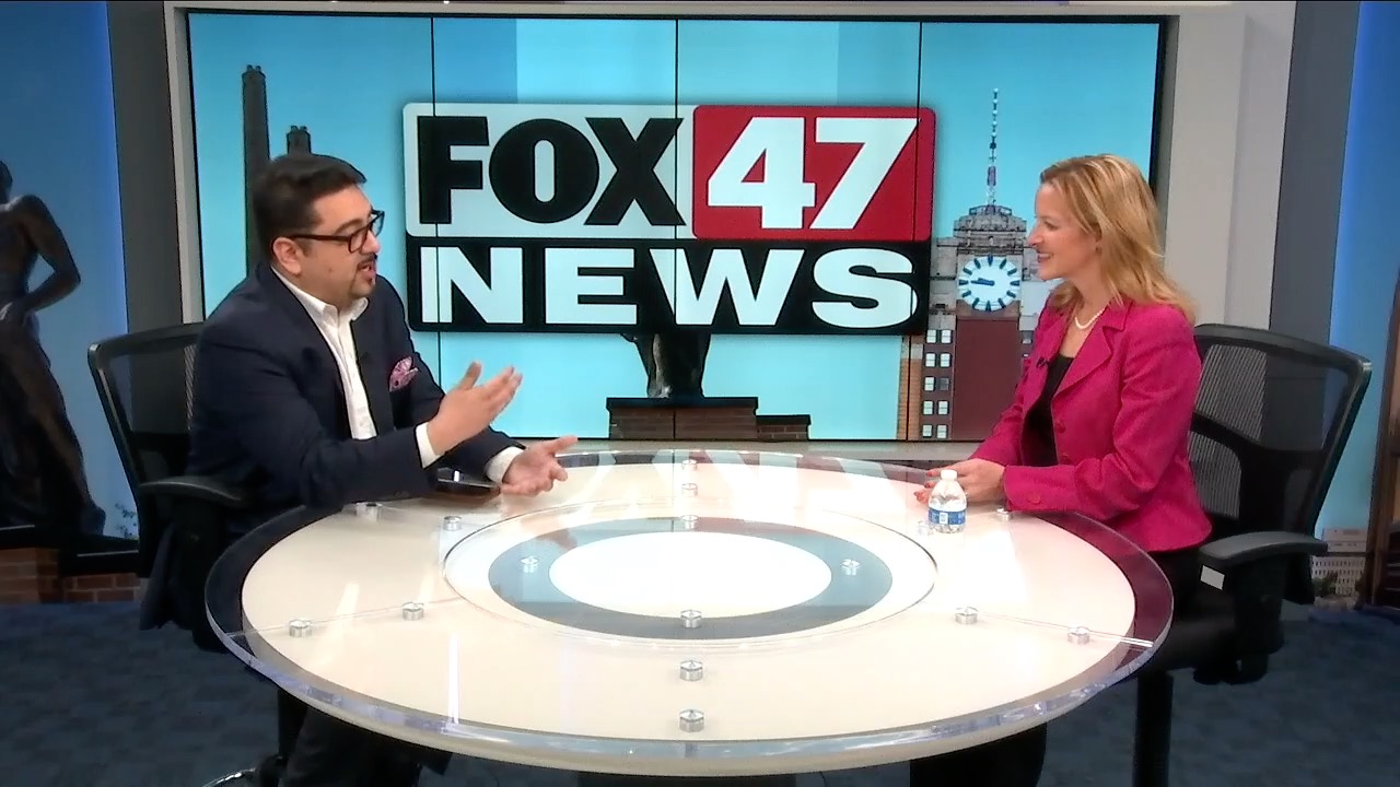 Danny Valle speaking with Michigan Secretary of State and gubernatorial candidate Jocelyn Benson