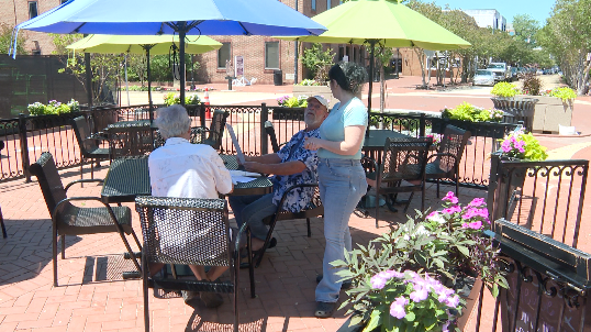 Andrea Beasley talking with customers