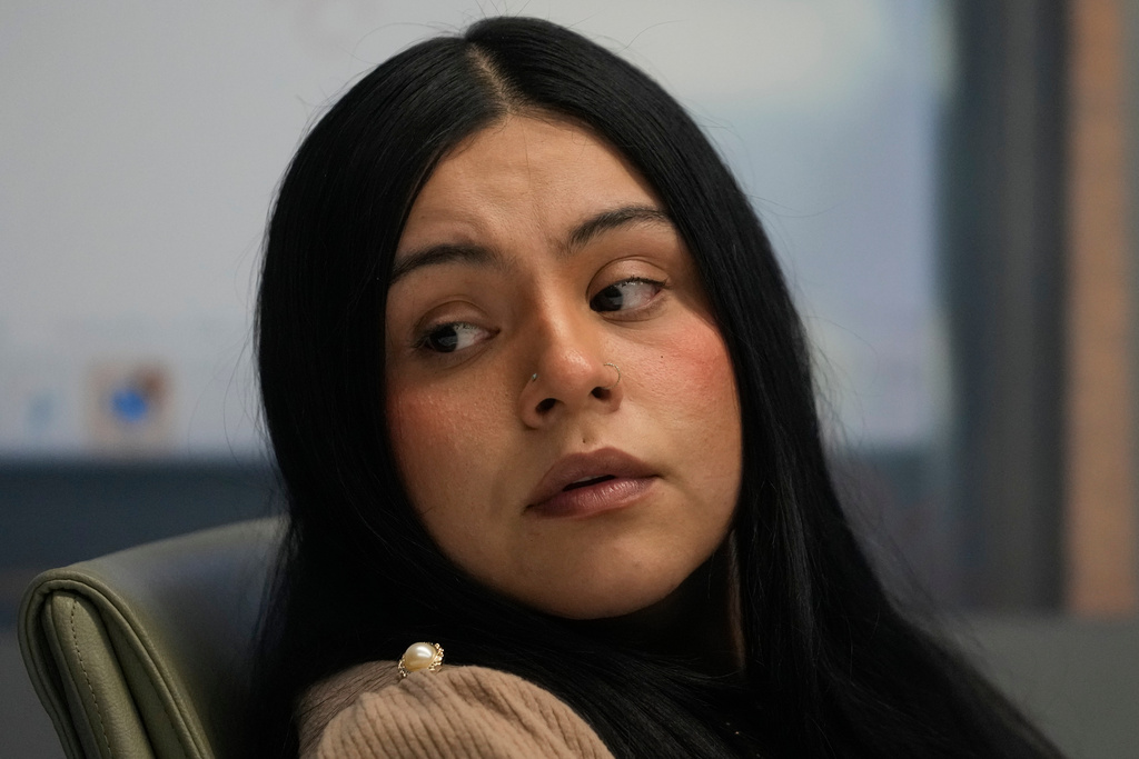 Marimar Martinez, a woman who was shot by a Border Patrol agent last year, sits with her attorneys during a press conference Wednesday, Feb. 11, 2026, in Chicago.