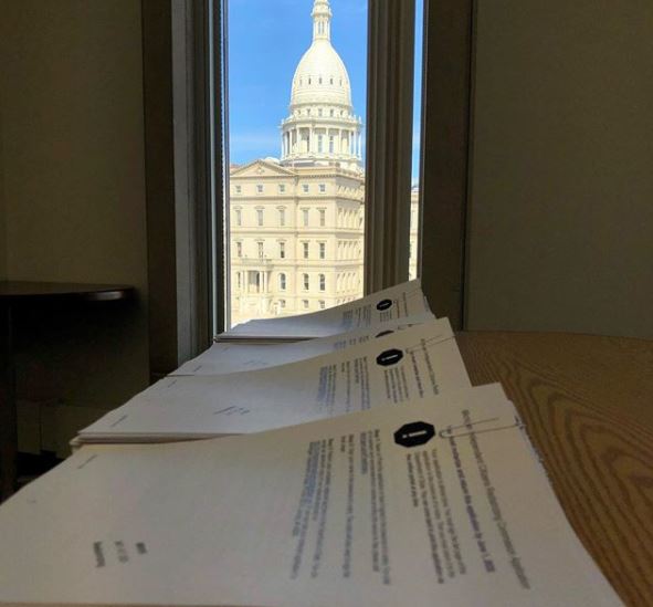 Redistricting commission applications with Michigan capitol.JPG