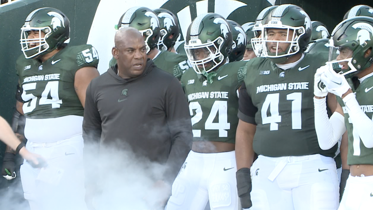 Mel Tucker enters the field at Spartan Stadium with the team against CMU on Sept. 1st