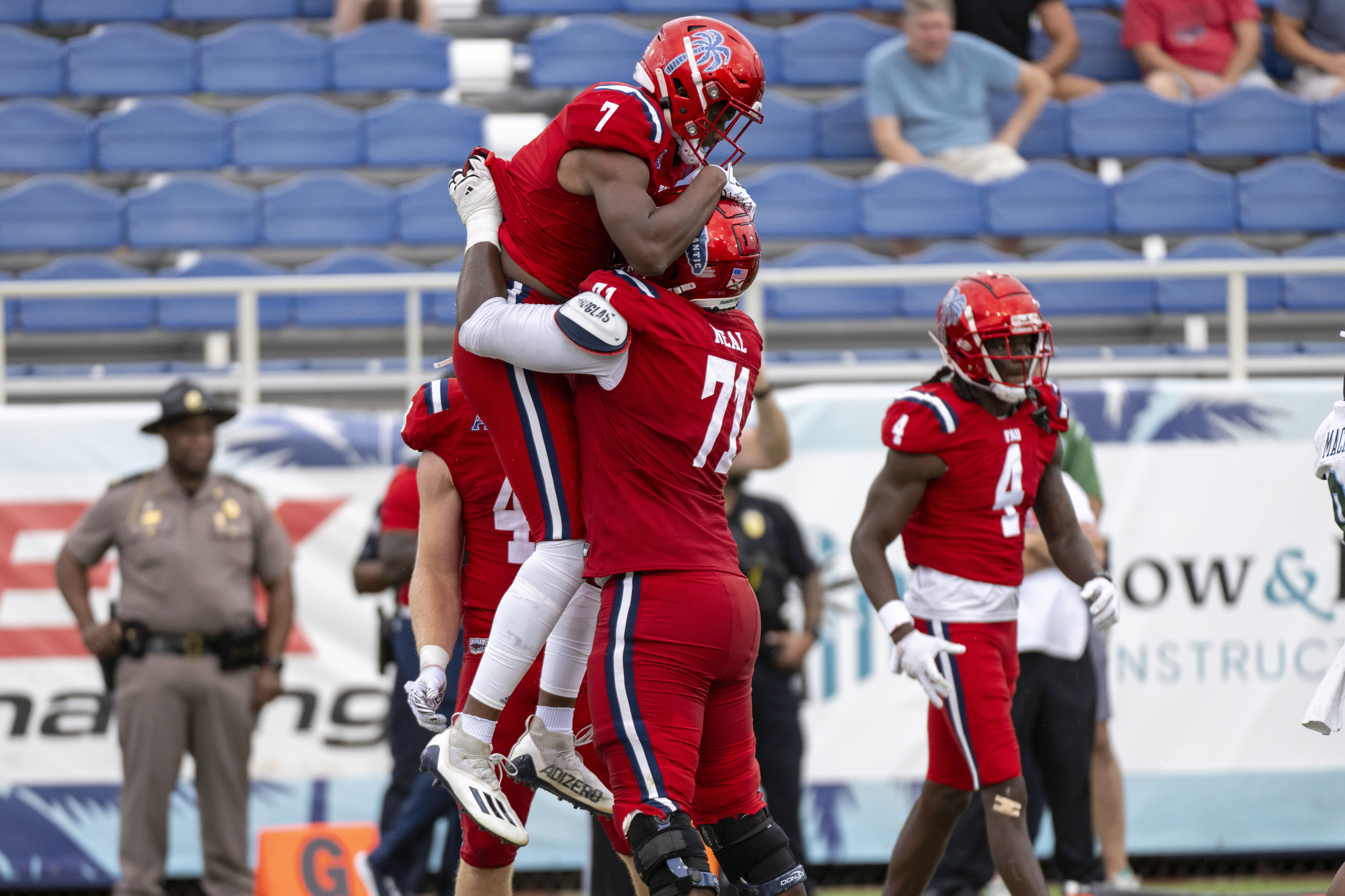 FAU Owls receiver Devin Price celebrates scoring 2-point conversion with offensive lineman Chaz Neal during second half vs. Tulane Green Wave, Nov. 18, 2023
