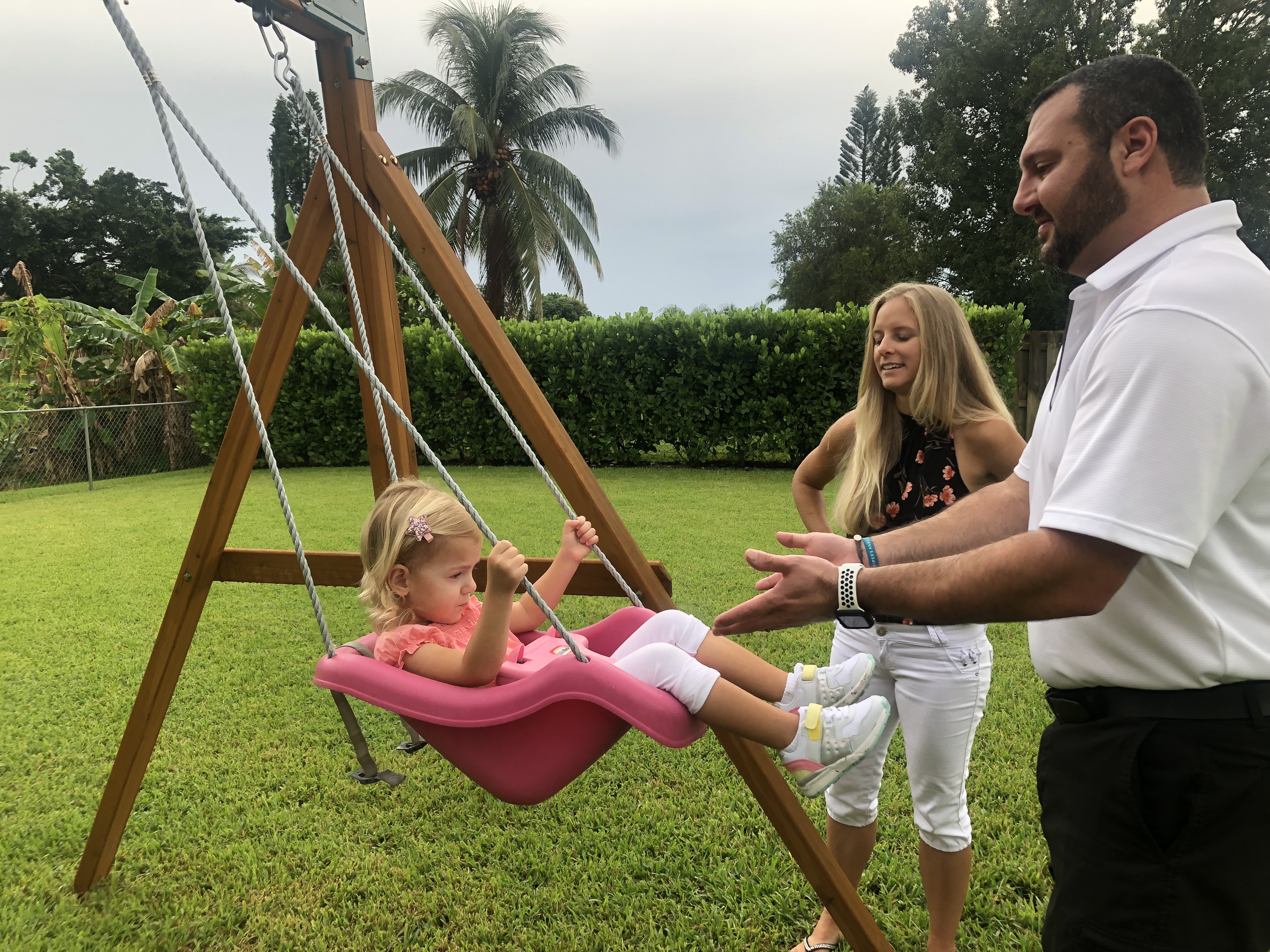 Three-year-old Hailey with parents