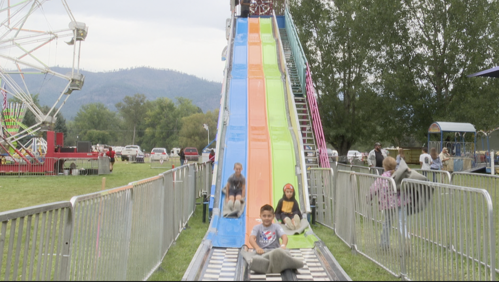 Kids ride the big slide at the Sanders County Fair, Plains Mt.