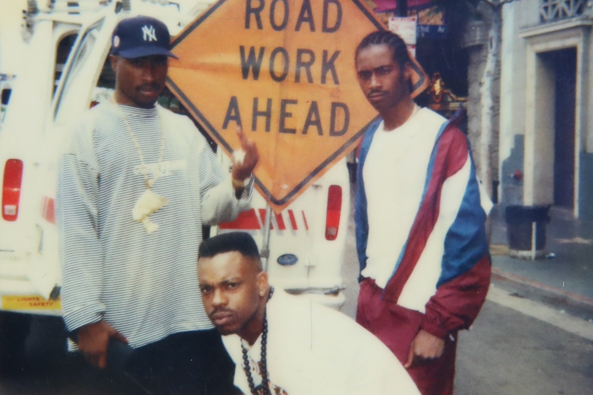 This undated photo provided by Maurice "Mopreme" Shakur on Wednesday, July 22, 2026, shows, from left, Tupac Shakur, Mike Cooley, and Mopreme Shakur, posing for a photo in Los Angeles. 