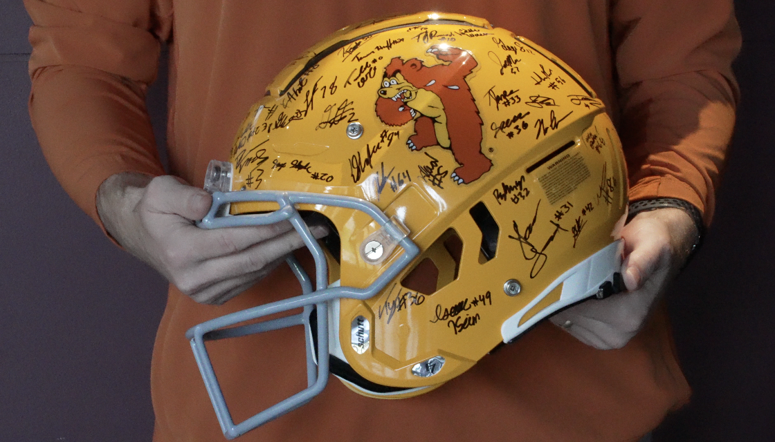authentic throwback helmet to be auctioned later, signed by the team 