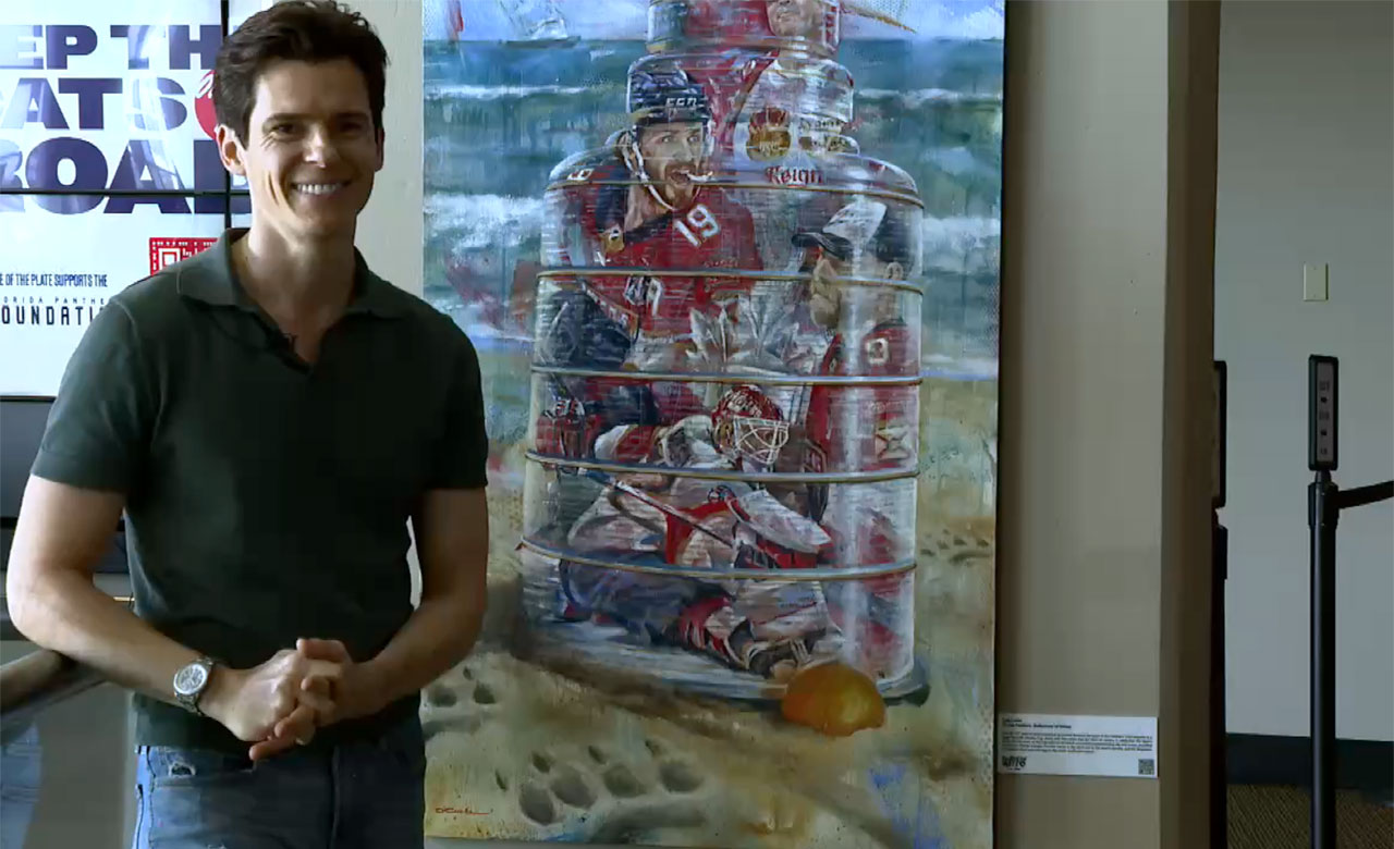 Kyle Lucks alongside his painting titled: "Florida Panthers: Reflections of Victory".