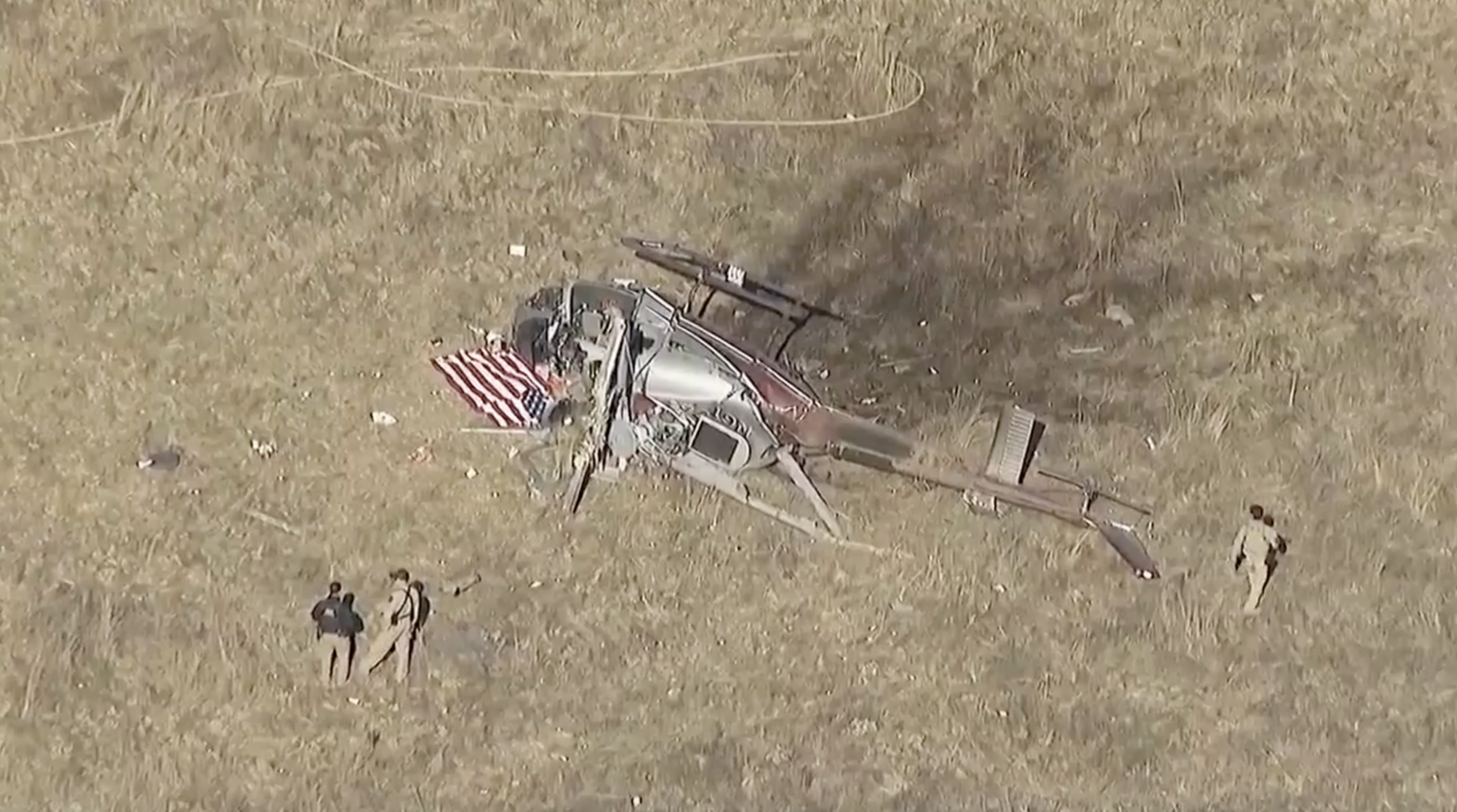  A screenshot from SKY 10 of a helicopter crash in the far East County, San Diego.