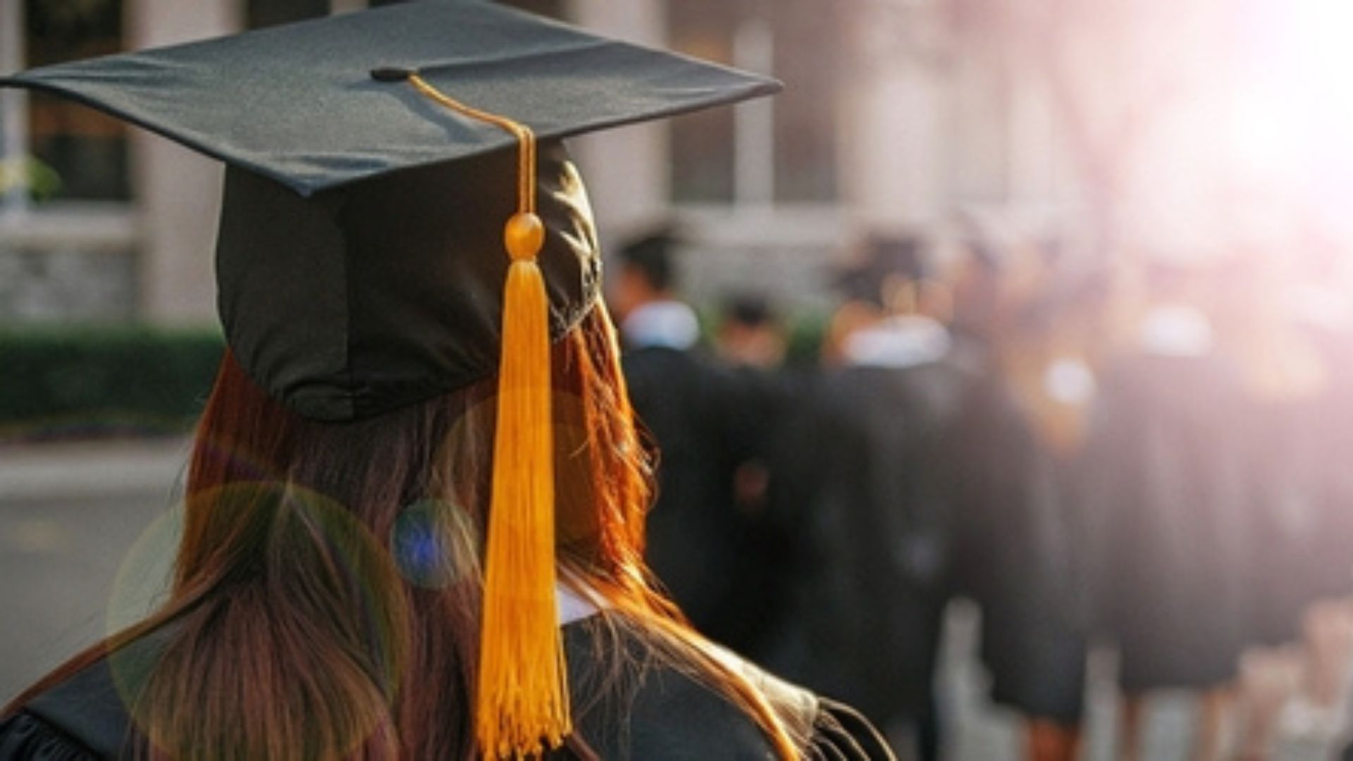 A college graduate in her cap and gown.