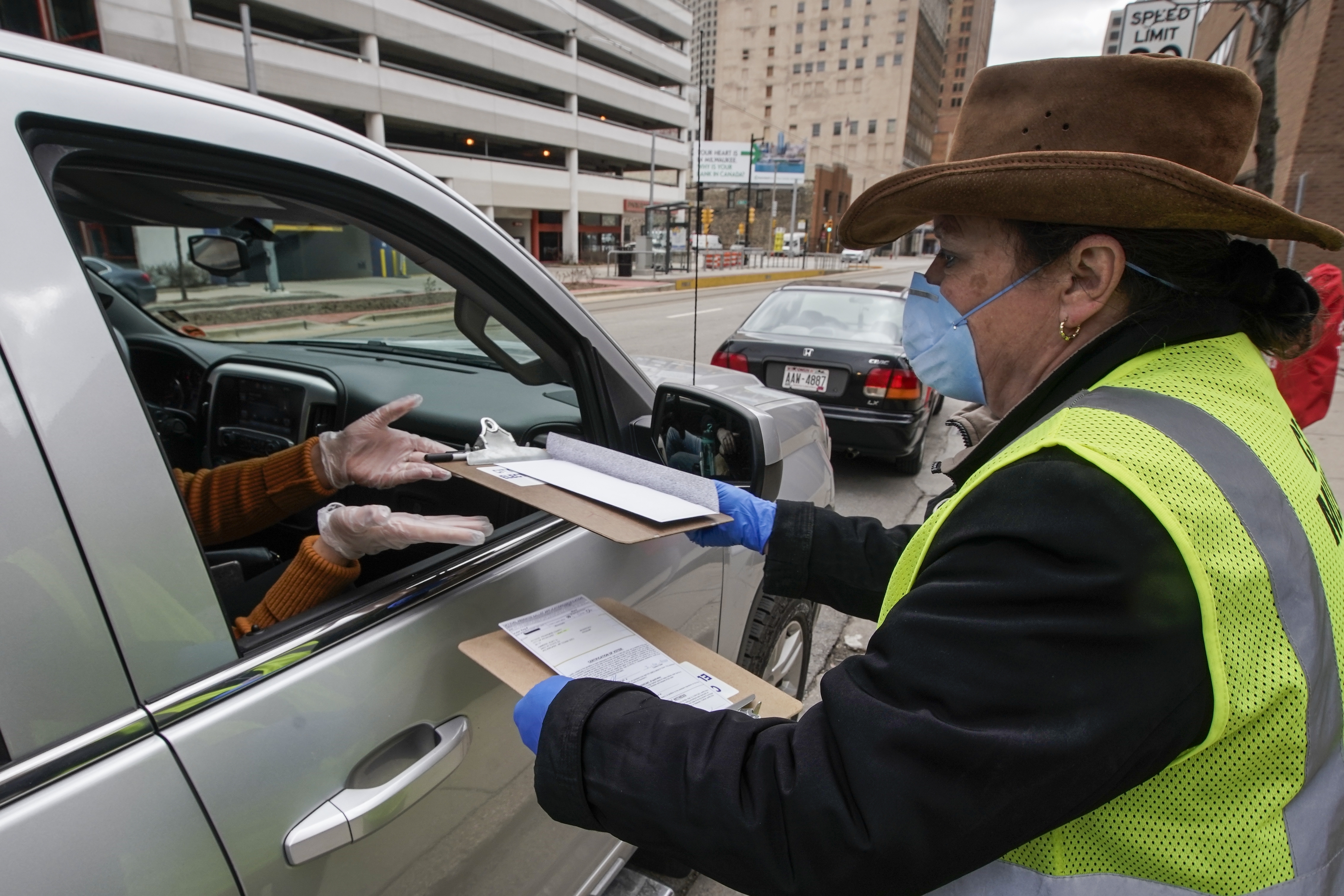 Judge won't delay Wisconsin primary election due to COVID-19 but extends voting