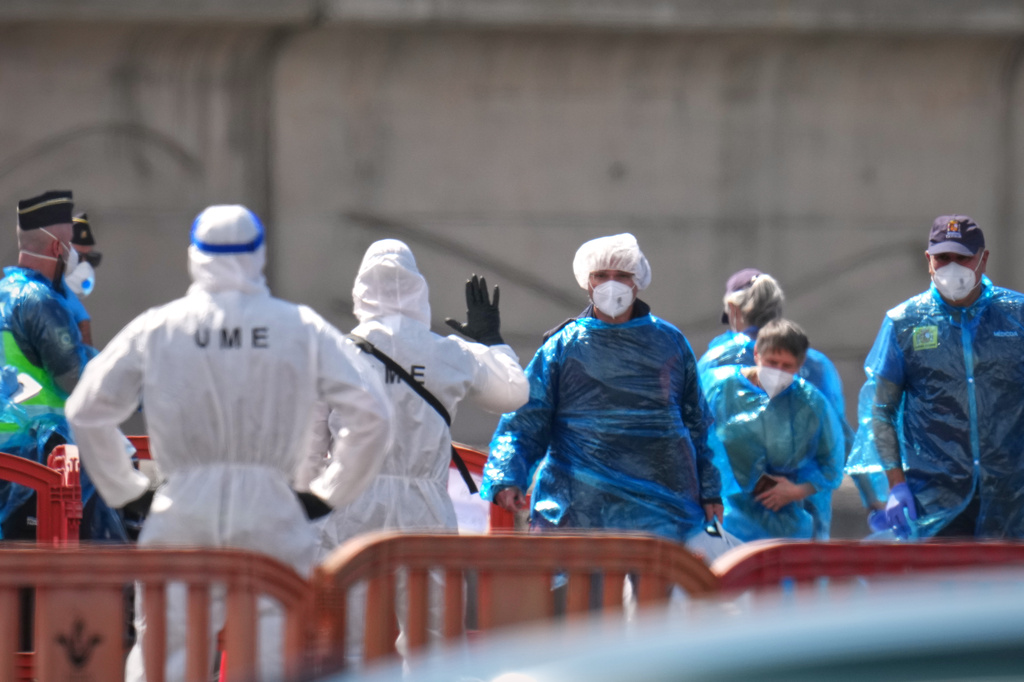 Passengers are disembarked from the hantavirus-stricken cruise ship MV Hondius at the port of Granadilla in Tenerife, Canary Islands, Spain, Sunday, May 10, 2026