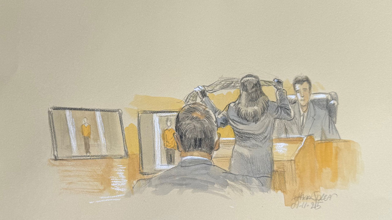 This courtroom sketch shows a pair of striped camouflage pants allegedly worn by Ryan Routh when he was booked are held up during the trial of Ryan Routh, who is charged with attempting to assassinate Donald Trump last year at a golf course near West Palm Beach, Thursday, Sept. 11, 2025, in Fort Pierce, Fla.