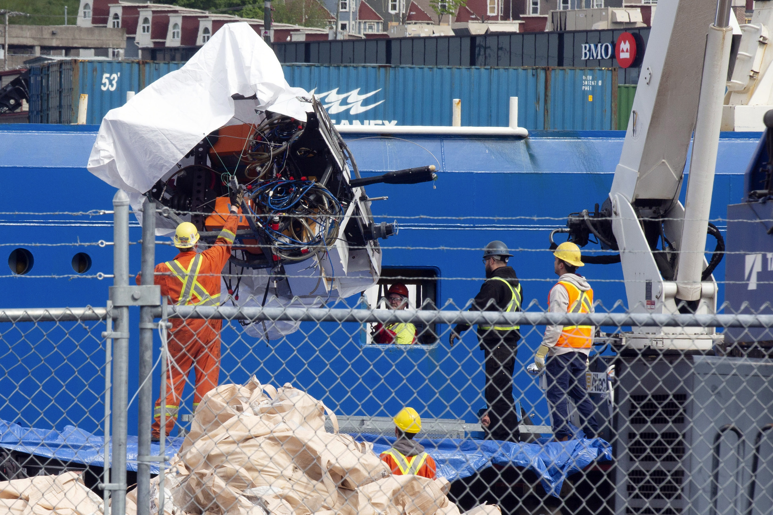 Debris from the Titan submersible, recovered from the ocean floor near the wreck of the Titanic, is unloaded from the ship Horizon Arctic at the Canadian Coast Guard pier in St. John's, Newfoundland, Wednesday, June 28, 2023. 