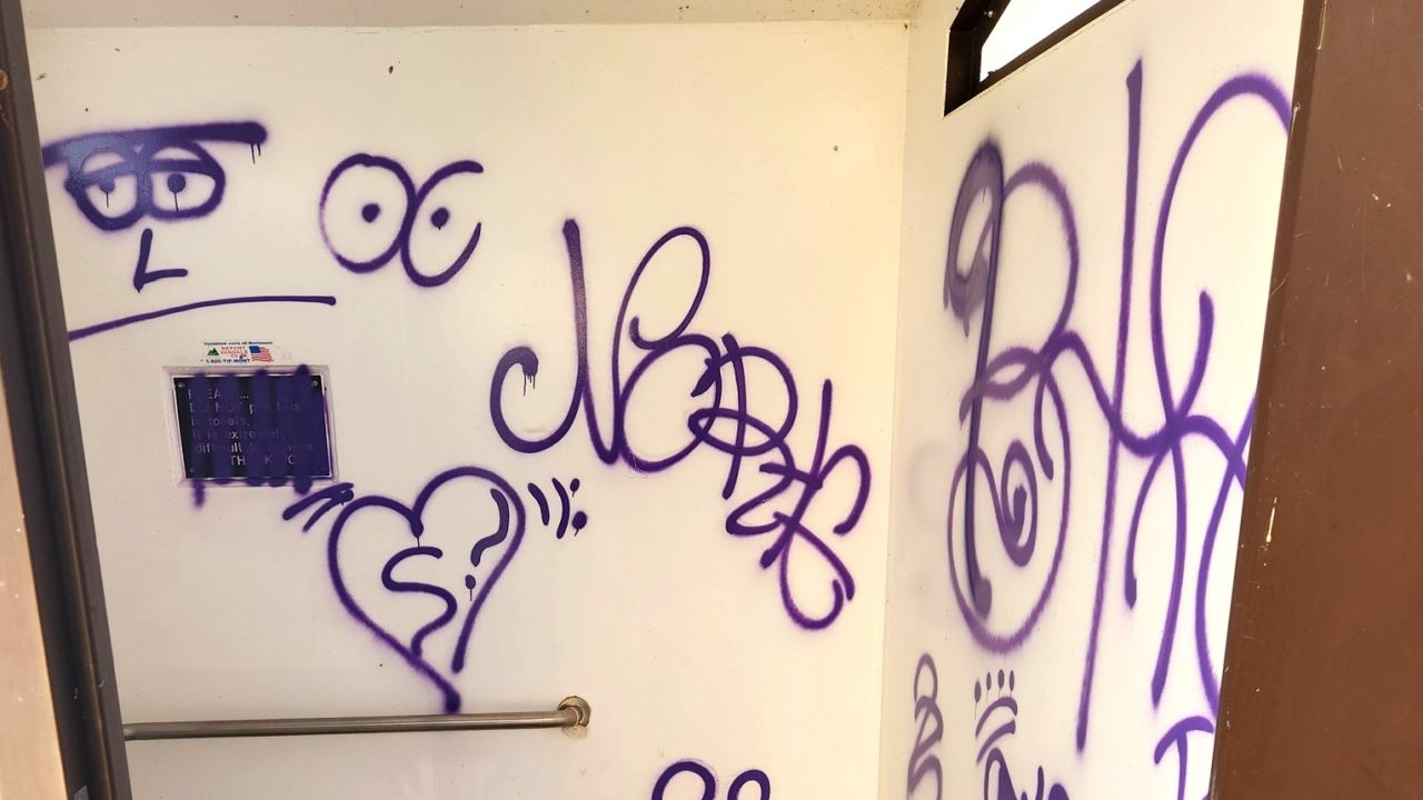 Rainbow Dam trailhead, extensive graffiti was spray painted in a latrine