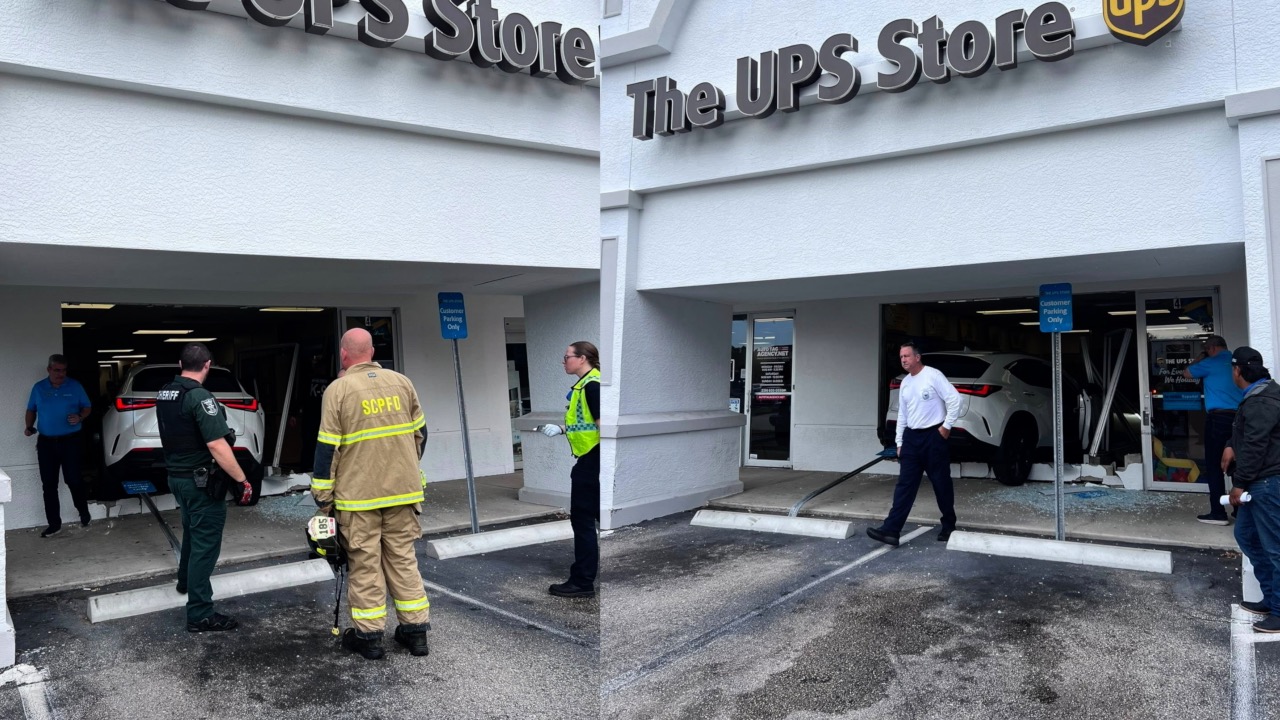 SUV crashes into UPS Store