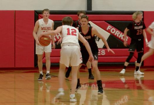 Three Fork's Owen Long stares down a Twin Bridges' defender