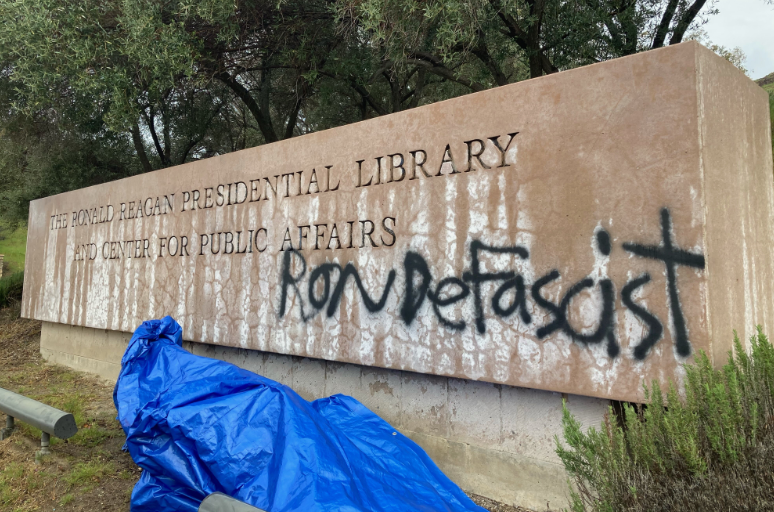 One of the entrance signs to the Reagan Presidential Library in Simi Valley, Calif., was vandalized ahead of Florida Gov. Ron DeSantis’ visit on March 5, 2023.
