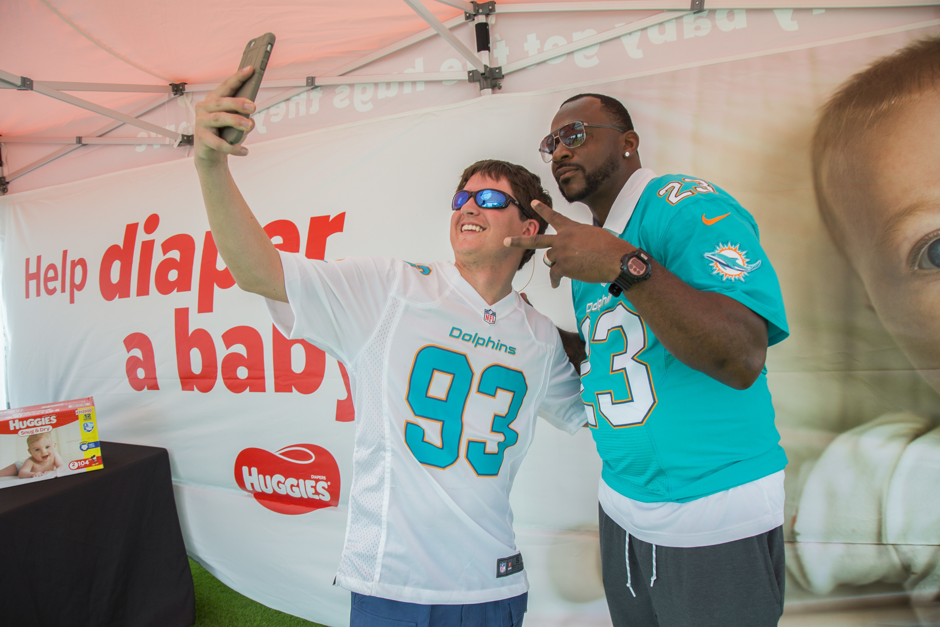 Former Miami Dolphins cornerback Patrick Surtain poses for photo with fan in 2017