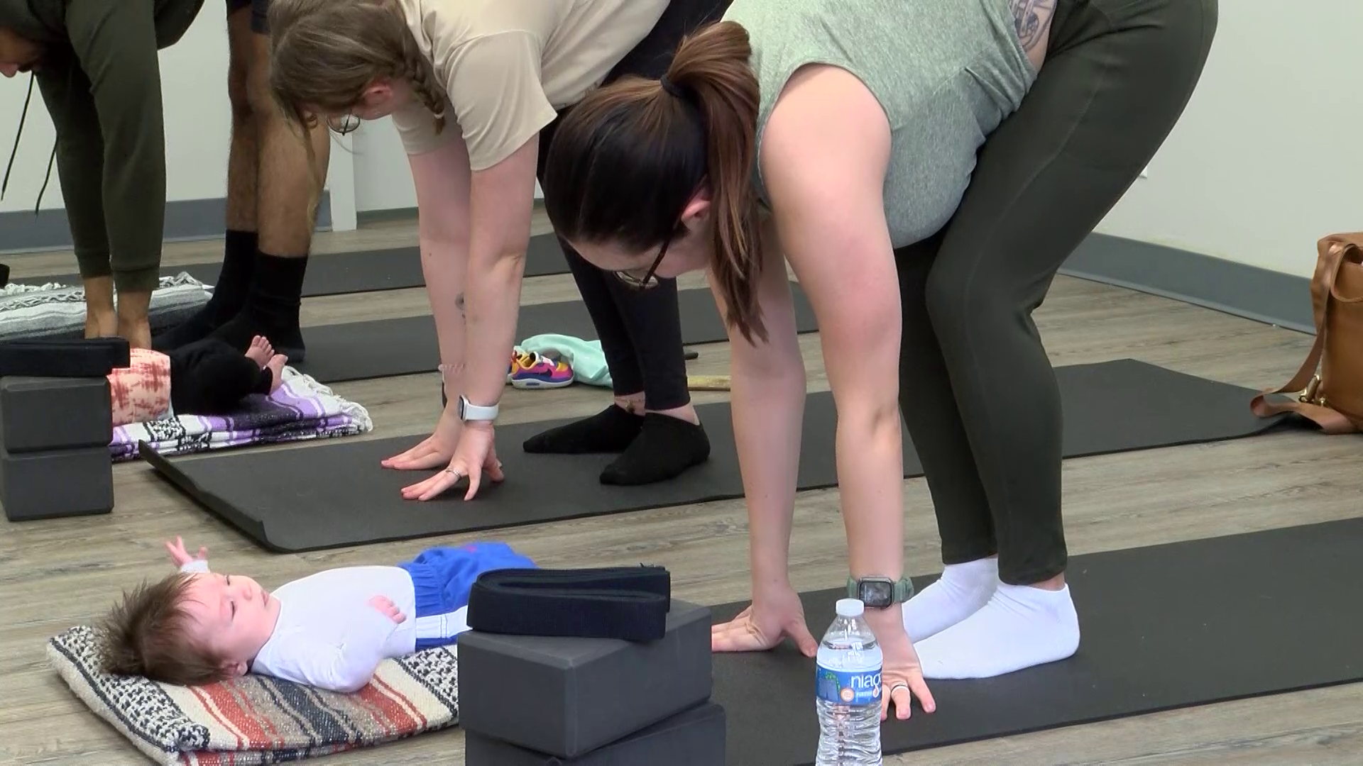 Parents enjoy 'Baby and Me' yoga class at Honey Hippo Play Café