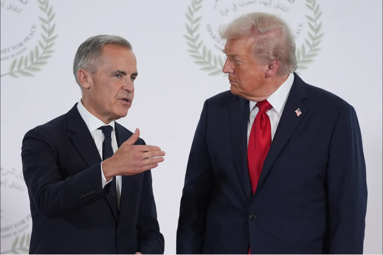 President Donald Trump greets Canada's Prime Minister Mark Carney during a summit to support ending the more than two-year Israel-Hamas war in Gaza after a breakthrough ceasefire deal, Monday, Oct. 13, 2025, in Sharm El Sheikh, Egypt.