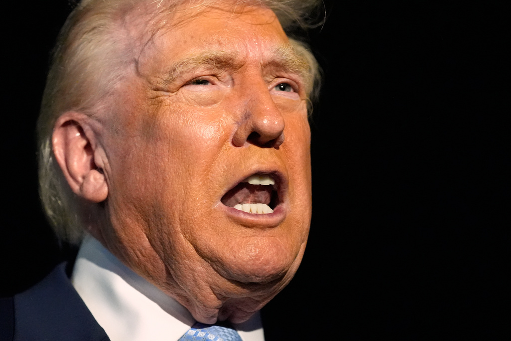 President Donald Trump speaks to reporters before boarding Air Force One.