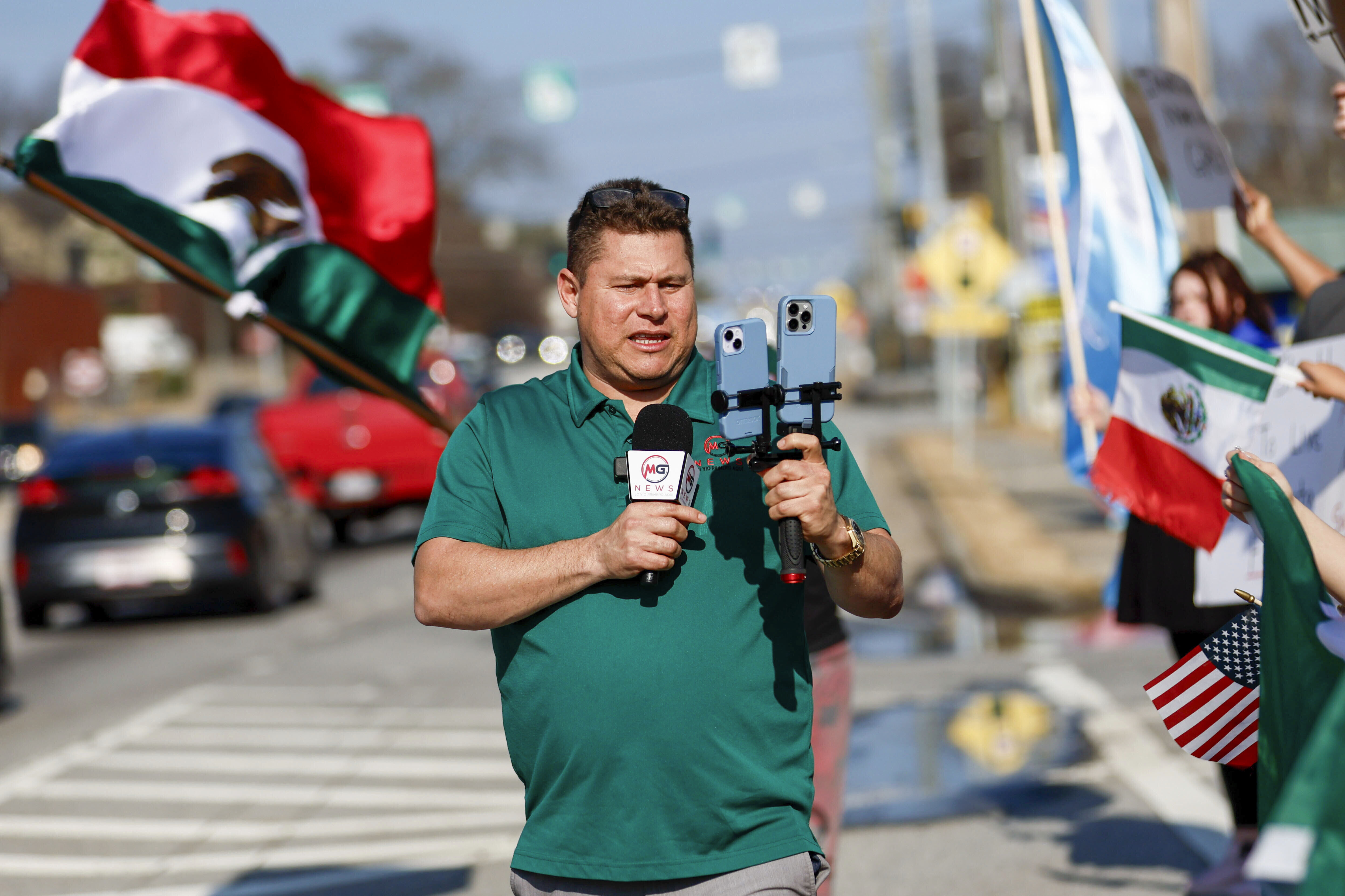 Mario Guevara, the metro Atlanta-based Spanish-language reporter, covers a protest against immigration enforcement on Buford Highway, Ga., on Saturday, Feb. 1, 2025. (