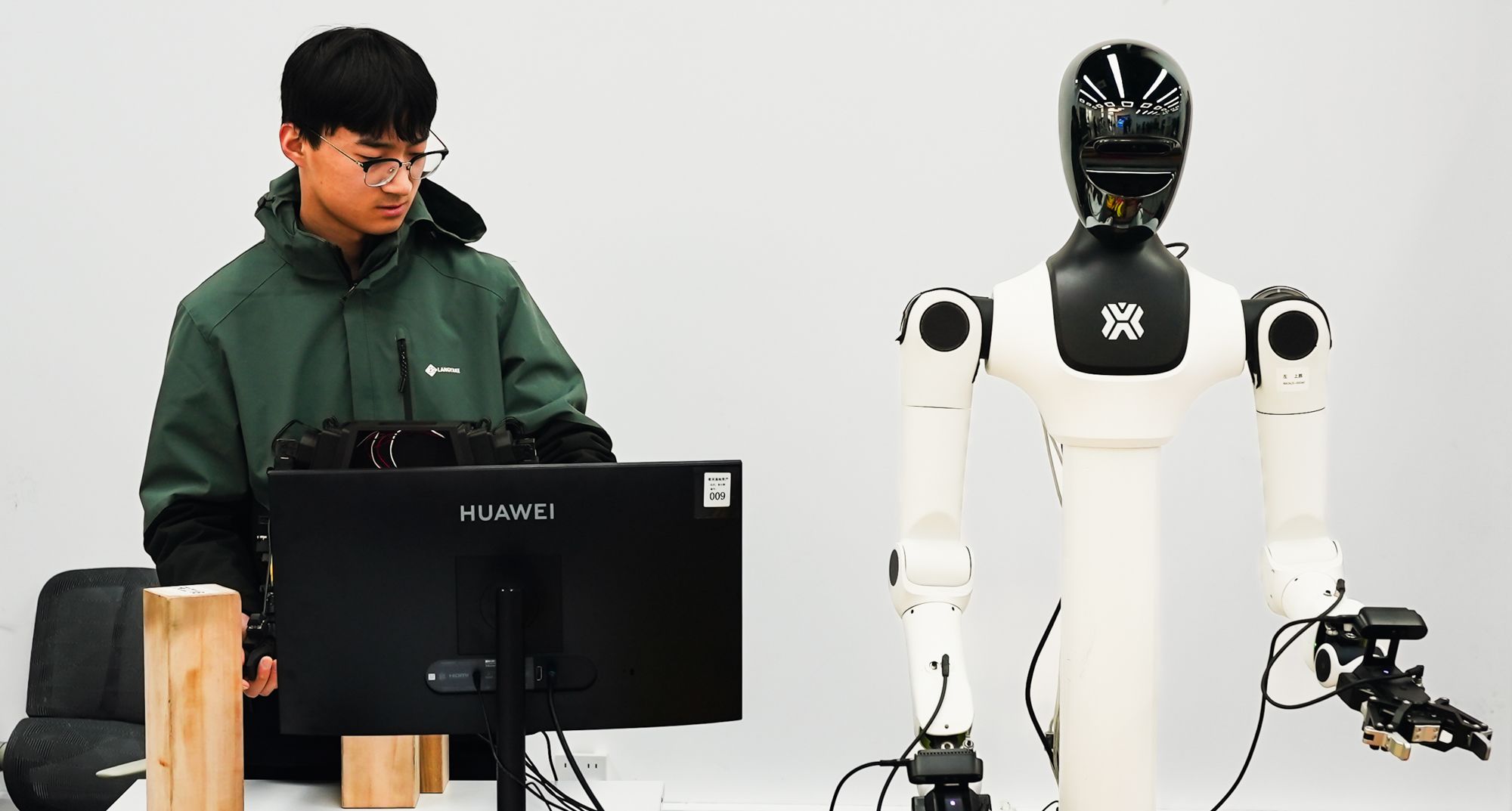 Workers are seen training humanoid robotsShot inside X-humanoid's robot training centre on the outskirts of Beijing on March 19.