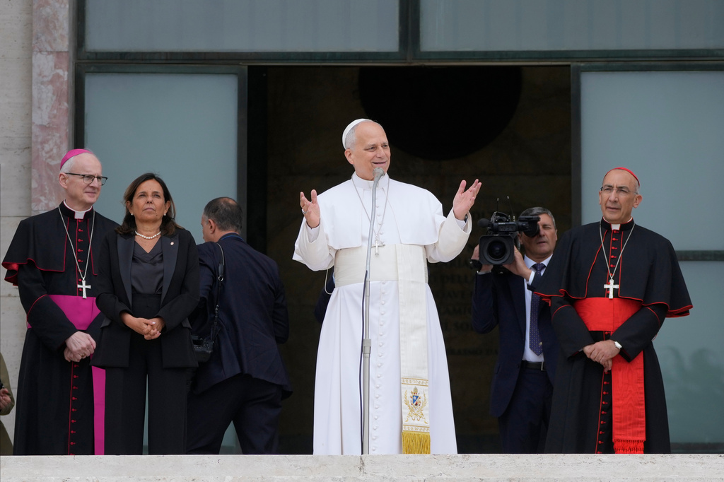Pope Leo XIV, accompanied by, from left, Prefect of the Pontifical Household Archbishop Petar Rajič, Dean Antonella Polimeni, and his vicar for the city of Rome Cardinal Baldo Reina, visits the Città Universitaria (University City) at Sapienza University of Rome to meet with faculty and students at the institution's primary campus, one of the world's oldest and largest universities, Thursday, May 14, 2026. 