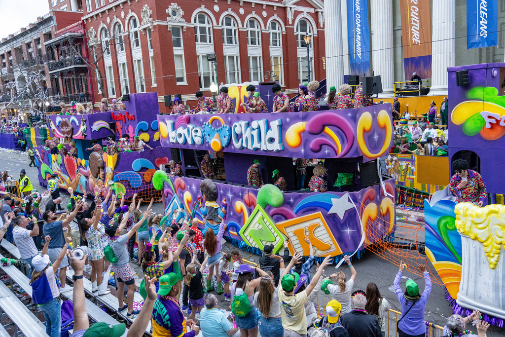 Attendees march during the annual Krewe of Tucks parade during the Mardi Gras season in New Orleans.