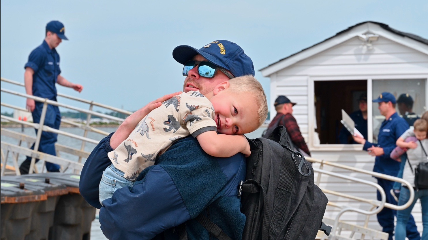 U.S. Coast Guard Petty Officer 2nd Class Kyle Hart, an operations specialist assigned to USCGC Tampa (WMEC 902), greets his family at the cutter's return to home port in Portsmouth, Virginia, April 26, 2023. Tampa returned home following an 88-day patrol in the Florida Straits and Caribbean Sea. 