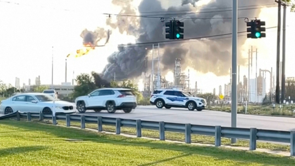 In this still image taken from a video provided by KBMT, smoke rises near the Valero Port Arthur Refinery in Port Arthur, Texas Monday, March 23, 2026.  (KBMT via AP)