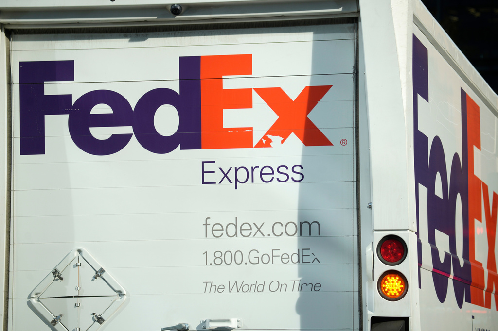 FILE - The company logo is shown on a FedEx delivery van, Sept. 13, 2023, in downtown Denver. 