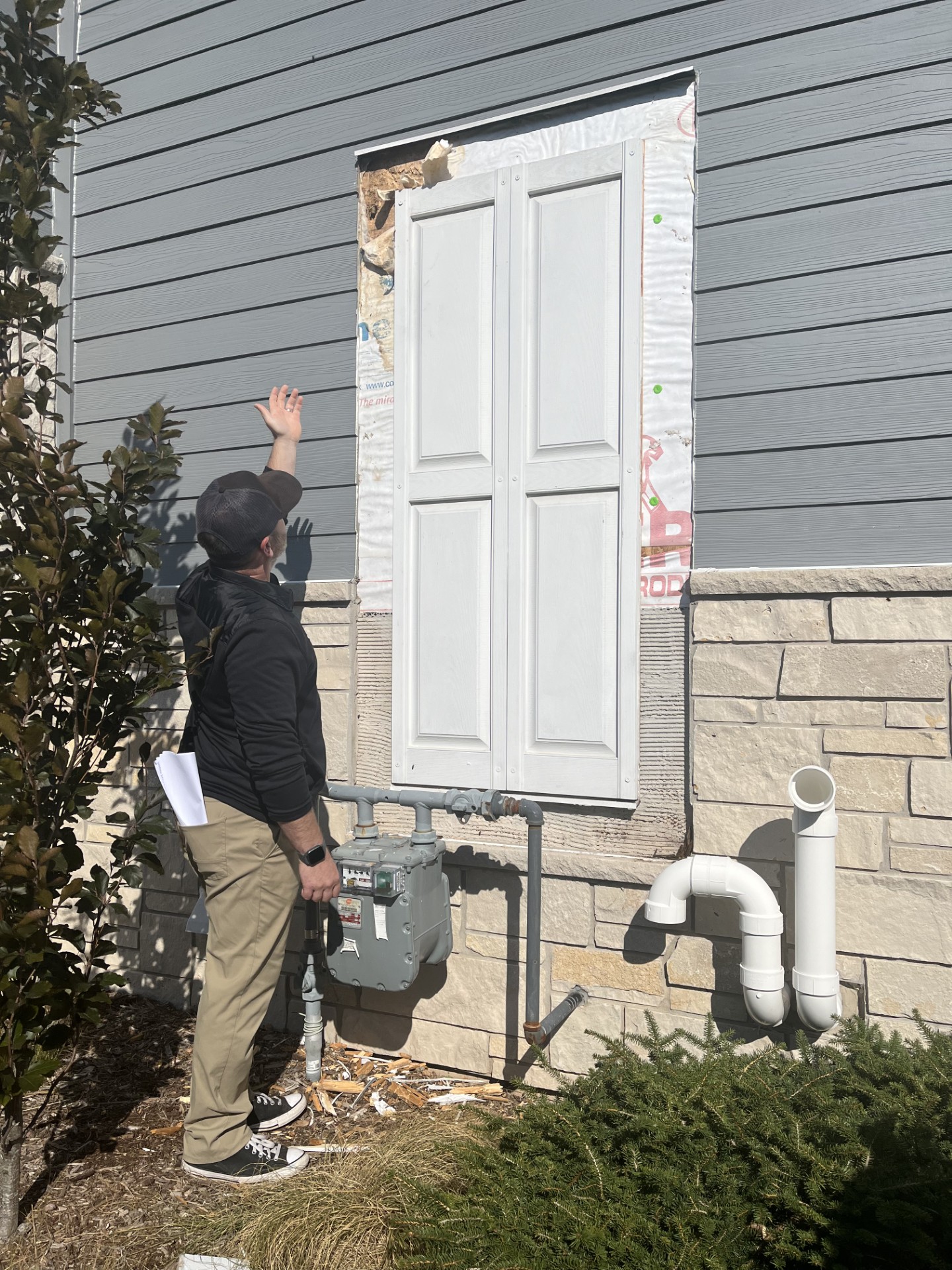 Contractor points to rot on a home in Mequon