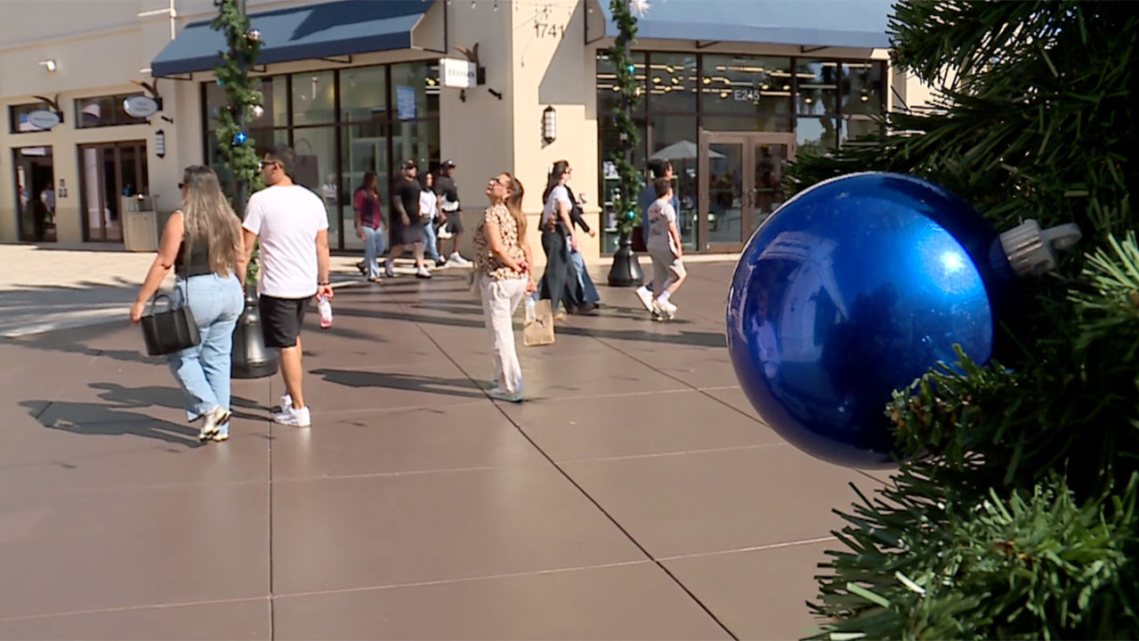 Shoppers search for post-holiday deals at Tanger Outlets in West Palm Beach on Dec. 26, 2025.