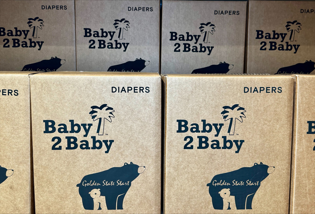 This photo provided by Baby2Baby shows stacks of packaged diapers Wednesday, May 7, 2026, at Baby2Baby's Los Angeles headquarters. 