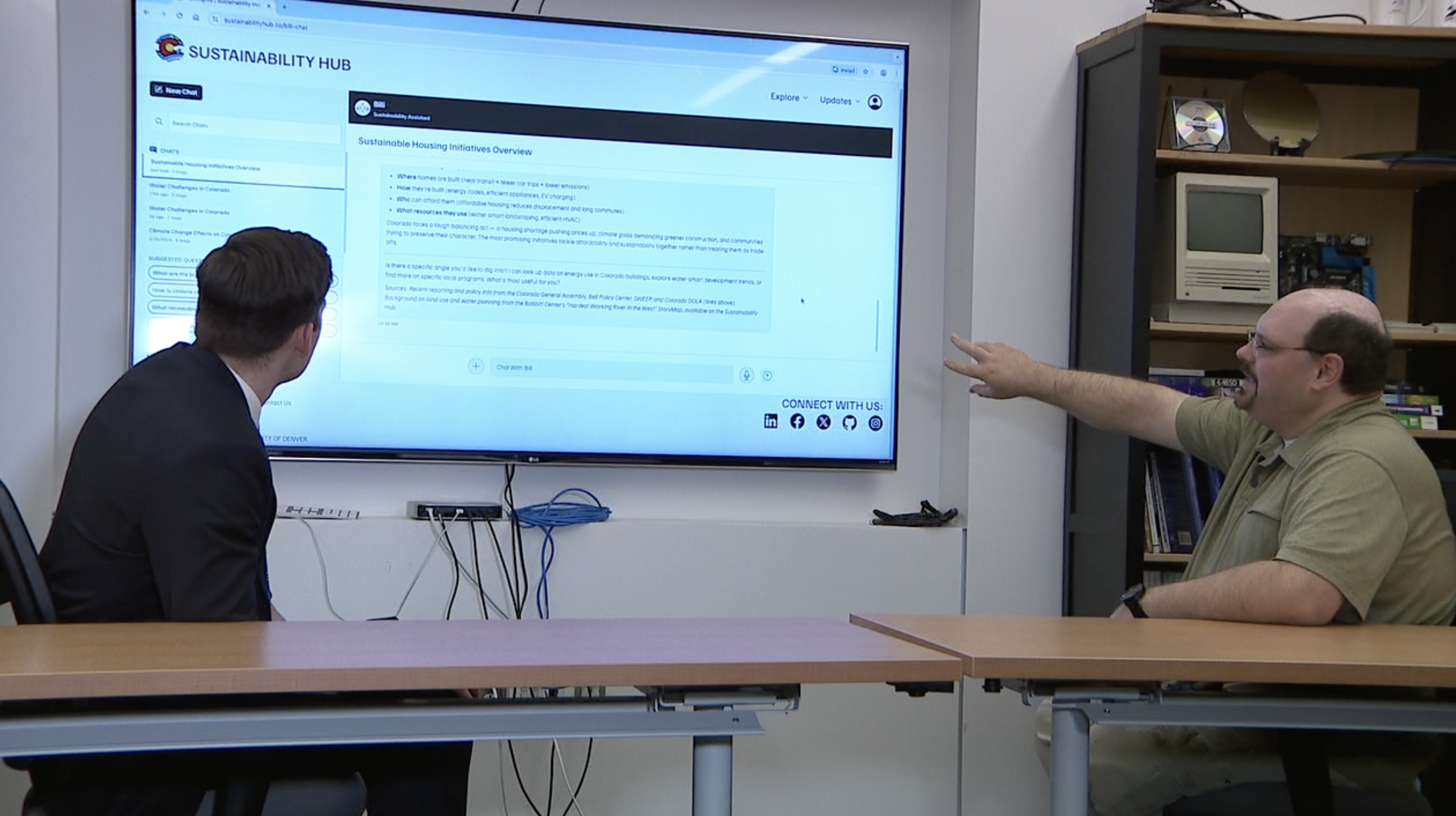 MSU Denver associate professor Daniel Pittman (right) explains the new 'Bili' chatbot to Denver7's Ryan Fish.