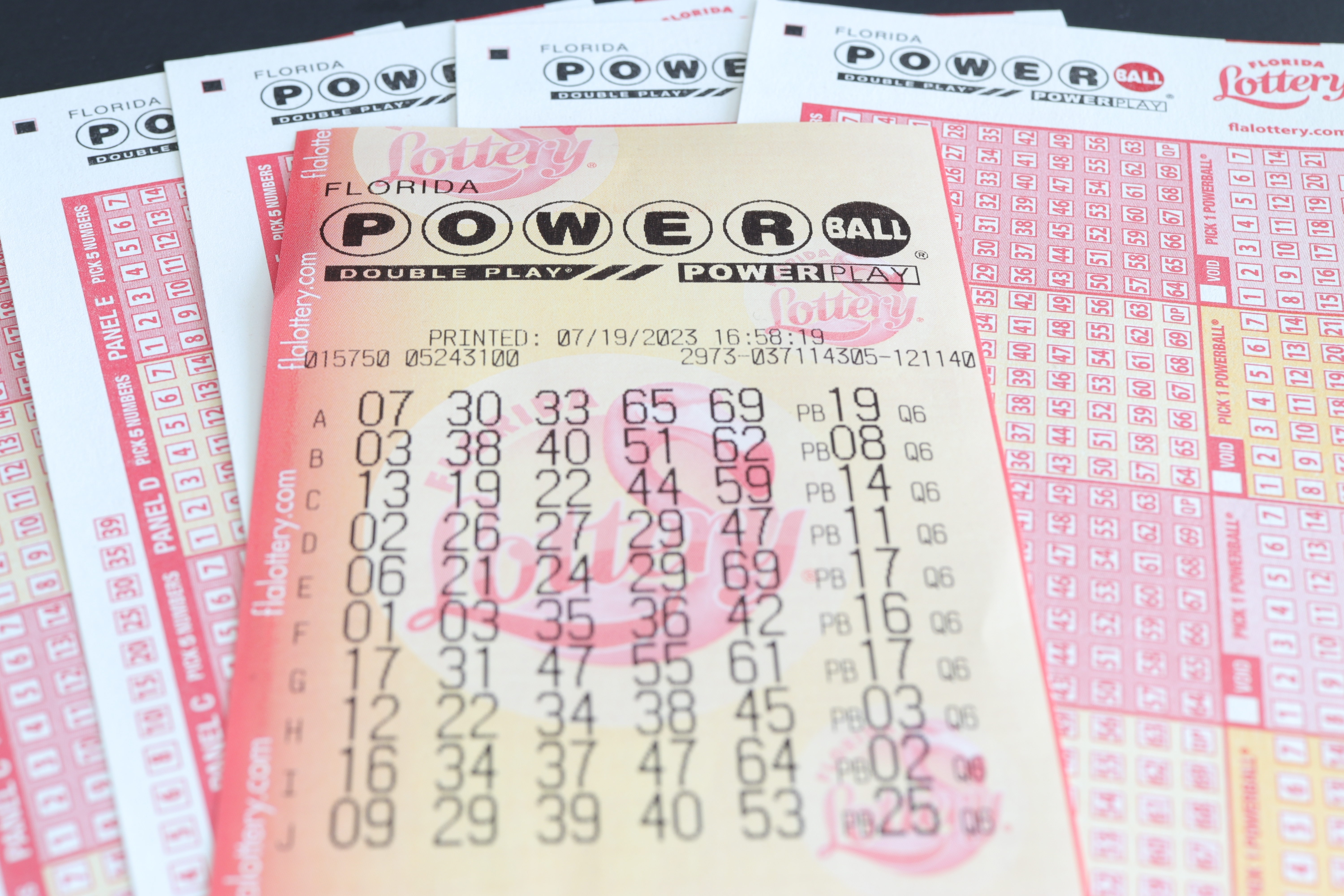 A Powerball ticket on top of Powerball pads. 