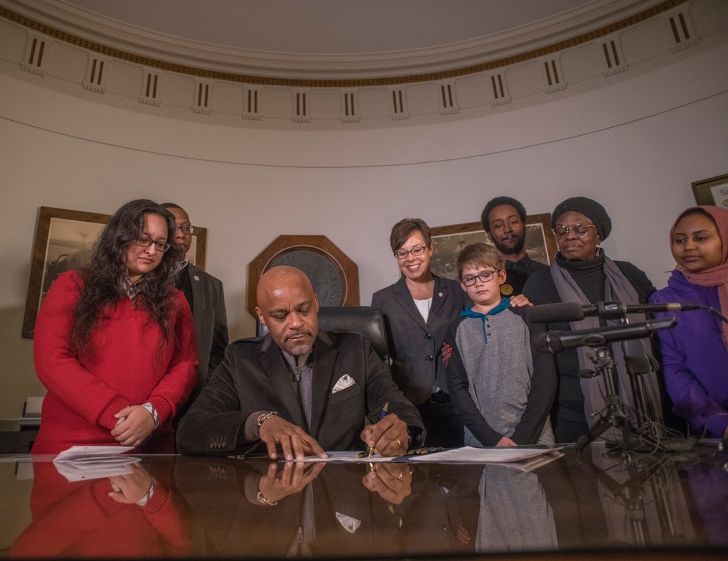 hancock at desk with staff.jpeg