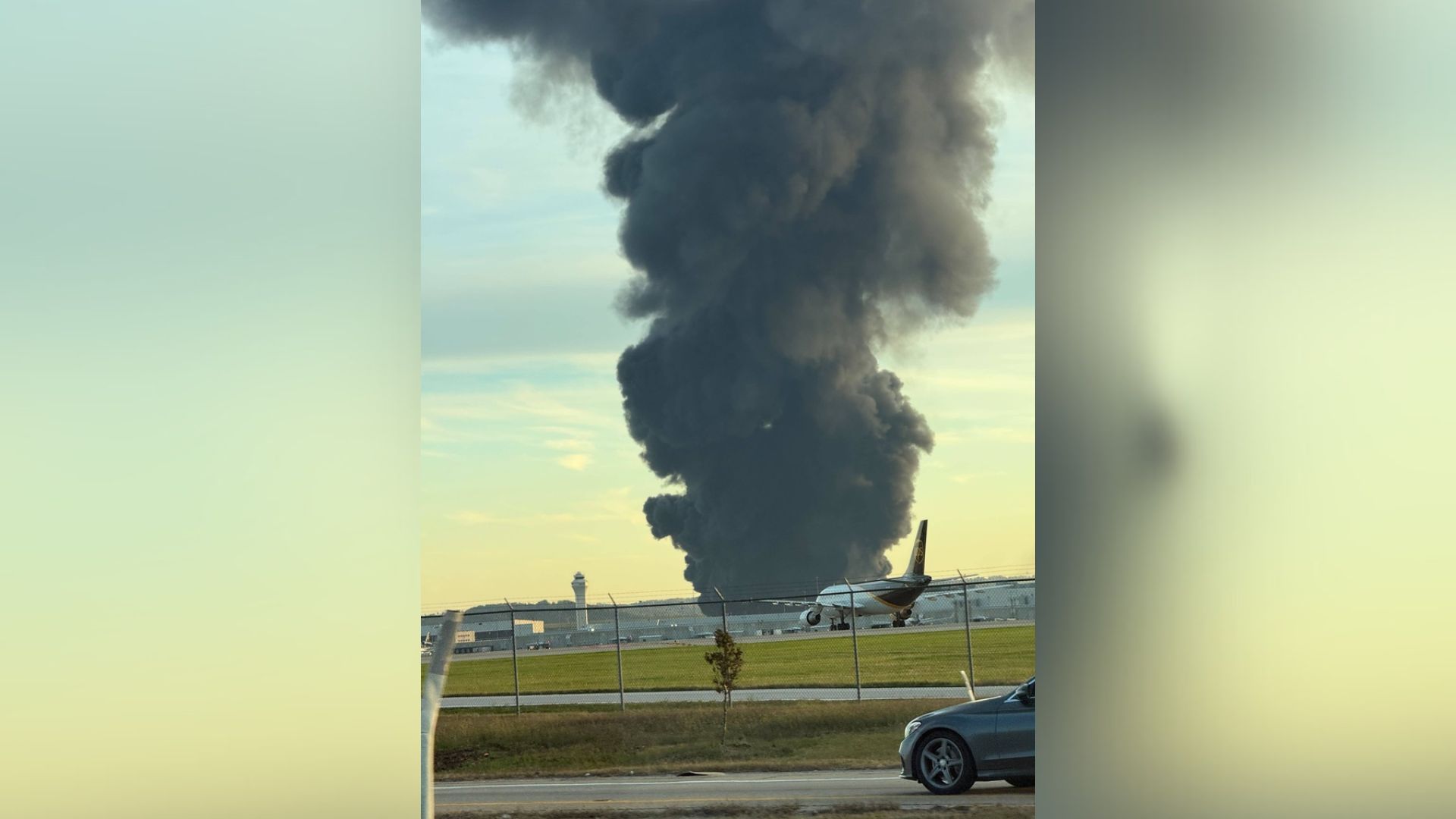 This photo provided by Brad Harvey shows thick, black smoke rising after reports of a plane crash near Louisville International Airport, Tuesday, Nov. 4, 2025, in Louisville, Ky.