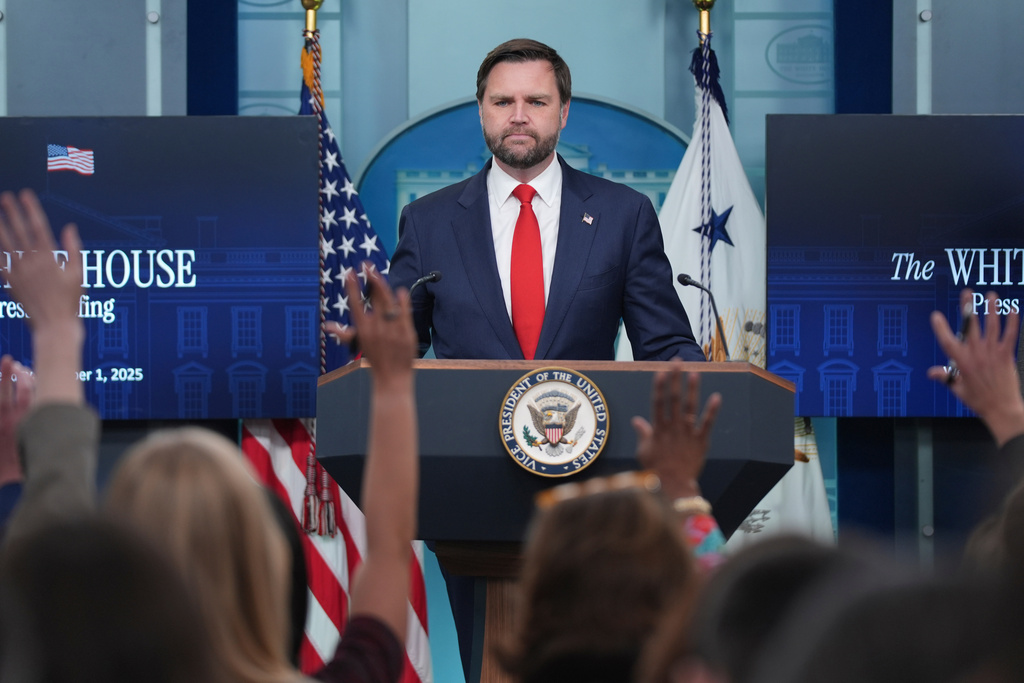 Members of the media raises their hands as Vice President JD Vance takes questions in the James Brady Press Briefing Room at the White House, Wednesday, Oct. 1, 2025, in Washington. 