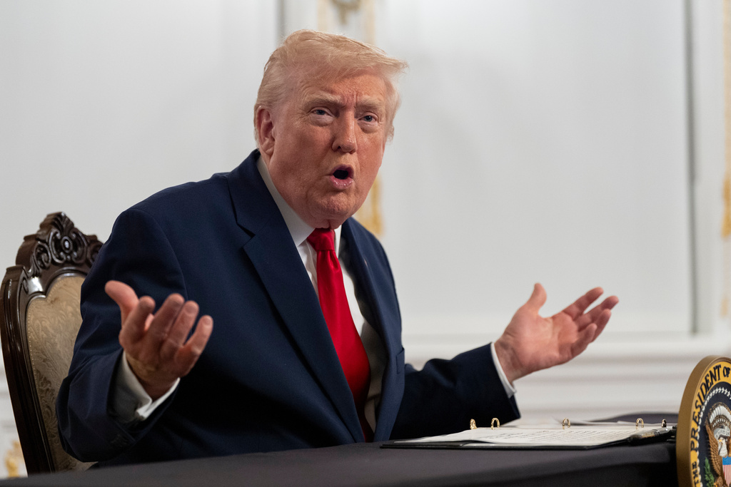 President Donald Trump speaks to reporters after speaking to troops via video from his Mar-a-Lago estate on Thanksgiving, Thursday, Nov. 27, 2025, in Palm Beach, Fla.