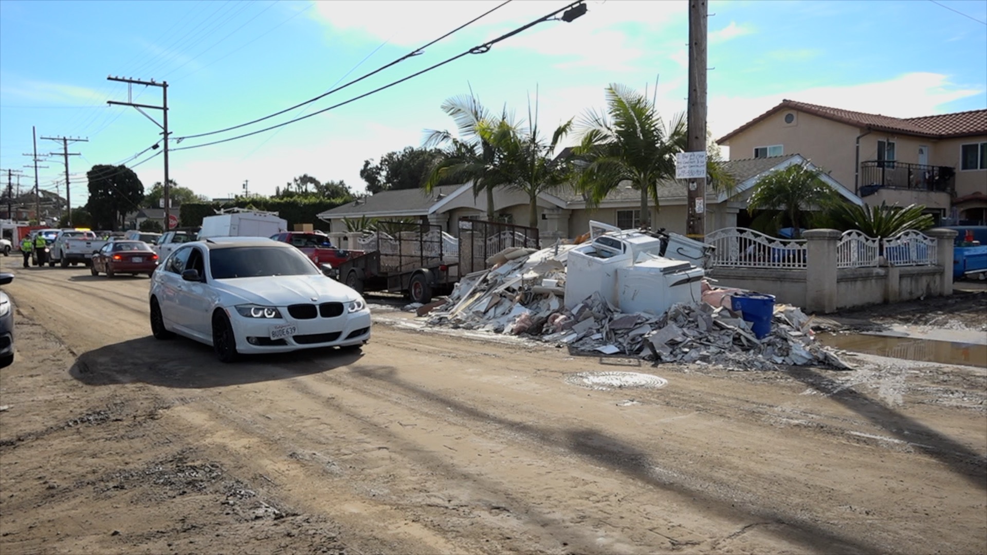 Trash line the streets of Southcrest in San Diego in the aftermath of the flood on January 22, 2023.