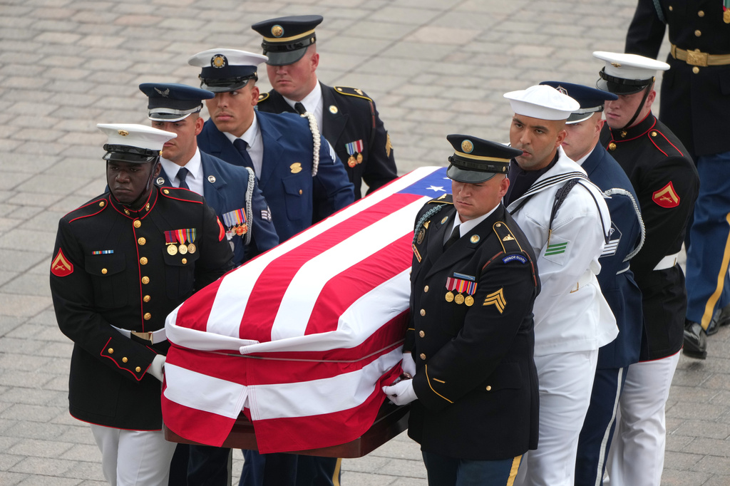 An Armed Forces Body Bearer Team moves the casket of Sen. Lindsey Graham, R-S.C., upon arrival for a Congressional tribute in the Rotunda of the U.S. Capitol, Tuesday, July 28, 2026, in Washington. 