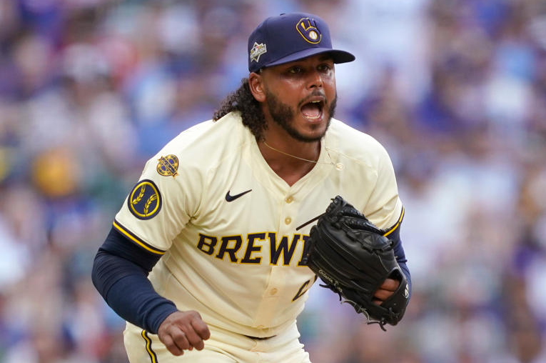 Milwaukee Brewers pitcher Freddy Peralta (51) reacts to striking out a batter during the fifth inning in Game 1 of baseball's National League Division Series against the Chicago Cubs on Saturday, Oct. 4, 2025, in Milwaukee.